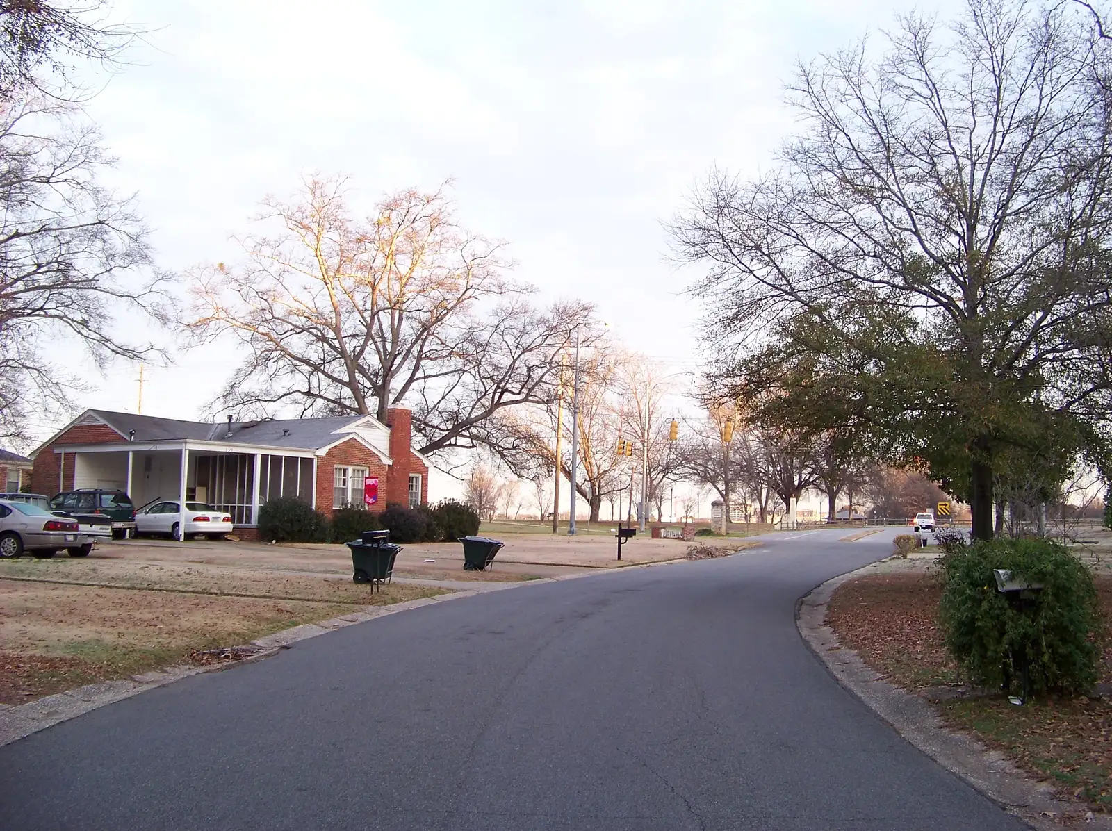 Brick ranch houses and bare winter trees line Brookhaven Drive, a residential street in Tuscaloosa.