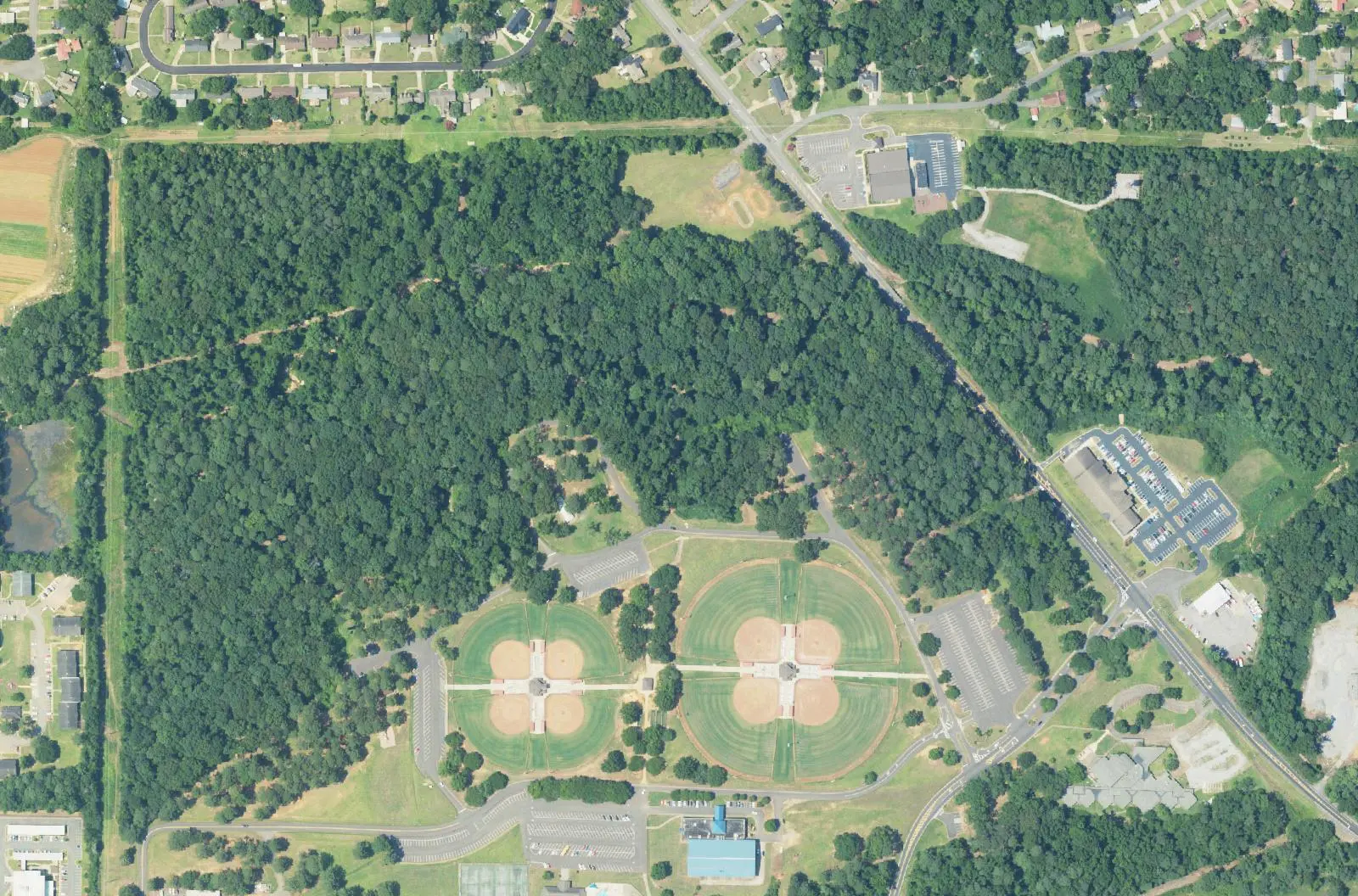 Aerial view of the ball fields, woods and activity center at Bowers Park in east Tuscaloosa.