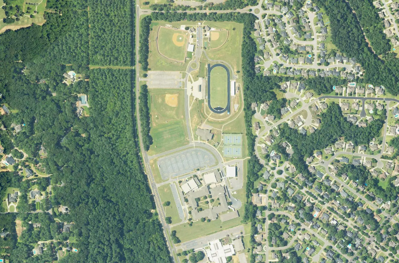 Aerial view of Northridge High School's track and ball fields beside Northridge Road, with neighborhoods to the east, in north Tuscaloosa.