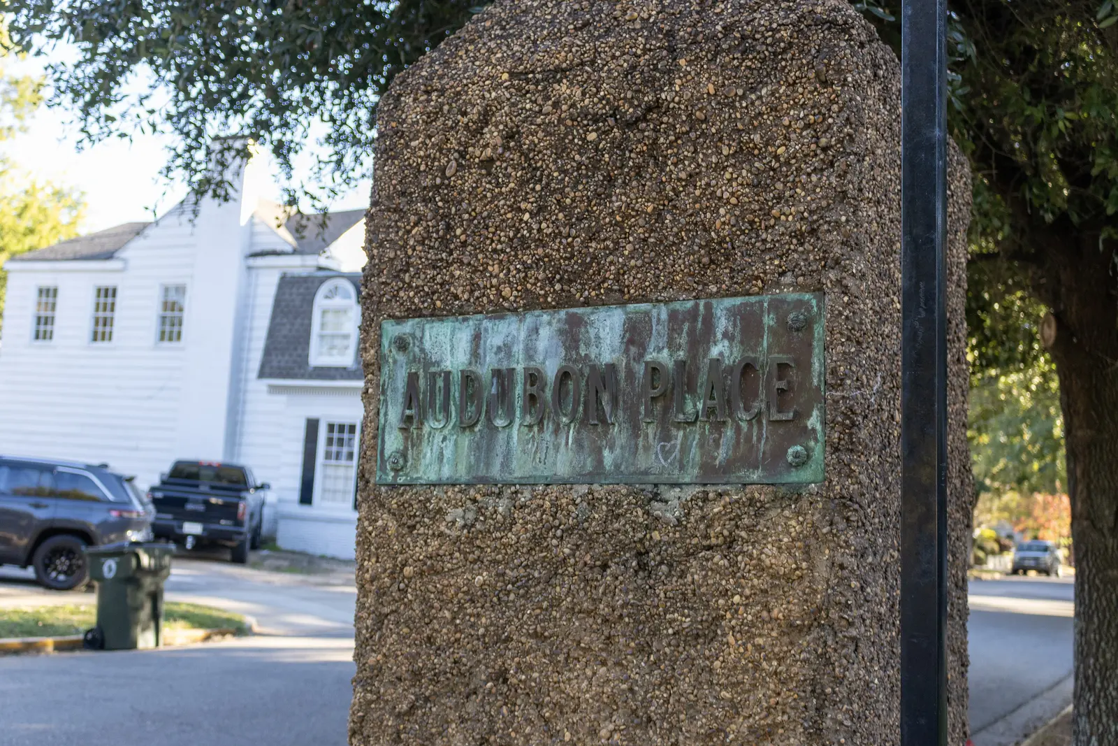 The stone Audubon Place marker at the entrance to one of the city's local historic districts near the University of Alabama campus.