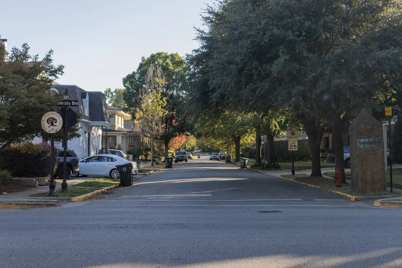 Homes line a tree-shaded street in the Audubon Place Historic District, just off University Boulevard in Tuscaloosa.