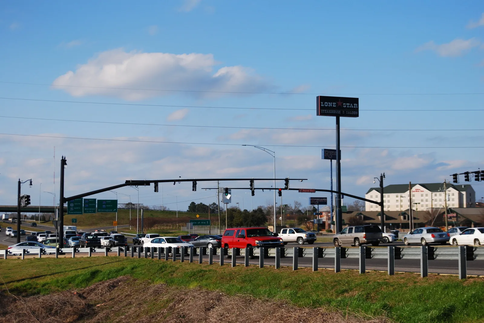 Traffic waits at the signal where Alabama 69 meets Skyland Boulevard in Tuscaloosa.