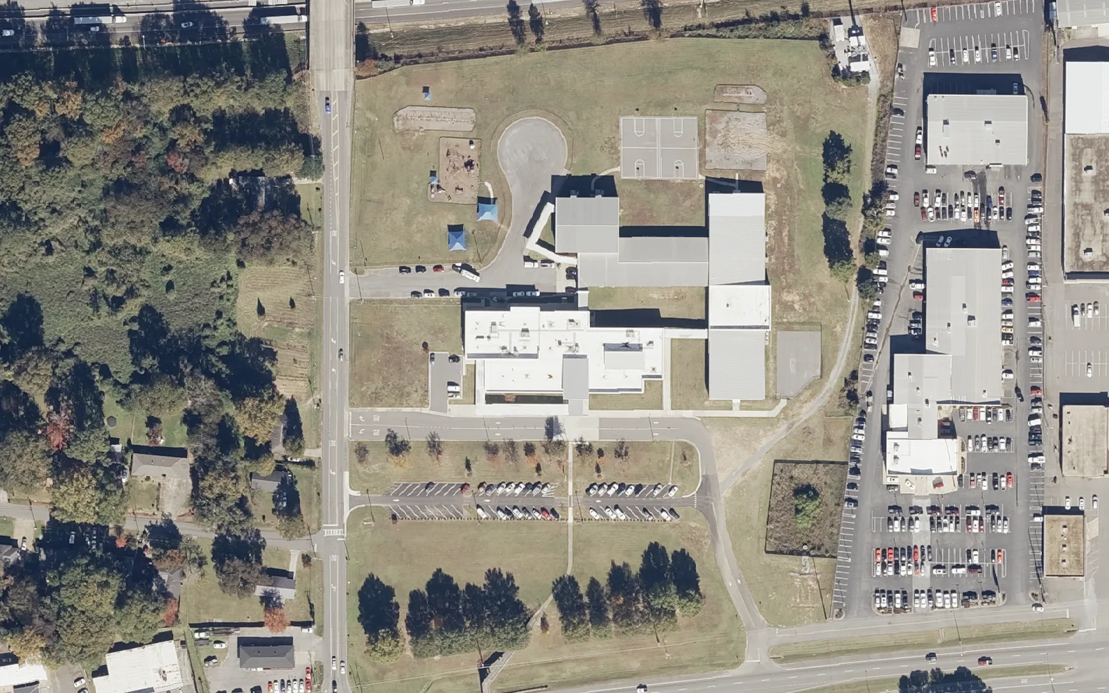 Skyland Elementary School, left of center, beside the shops on Skyland Boulevard East in south Tuscaloosa, seen from the air in 2021